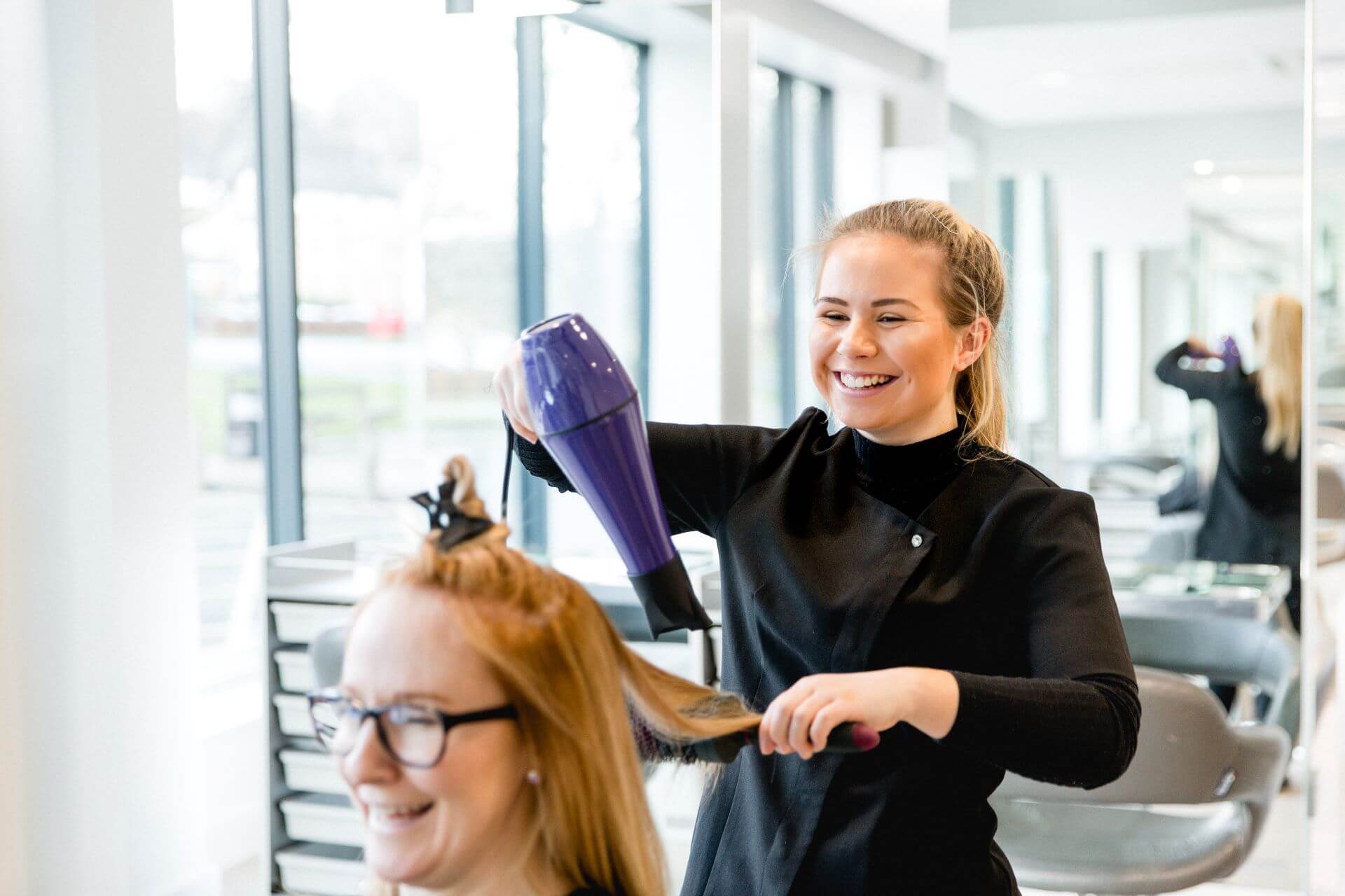 http://Hairdressing%20students%20drying%20a%20customers%20hair