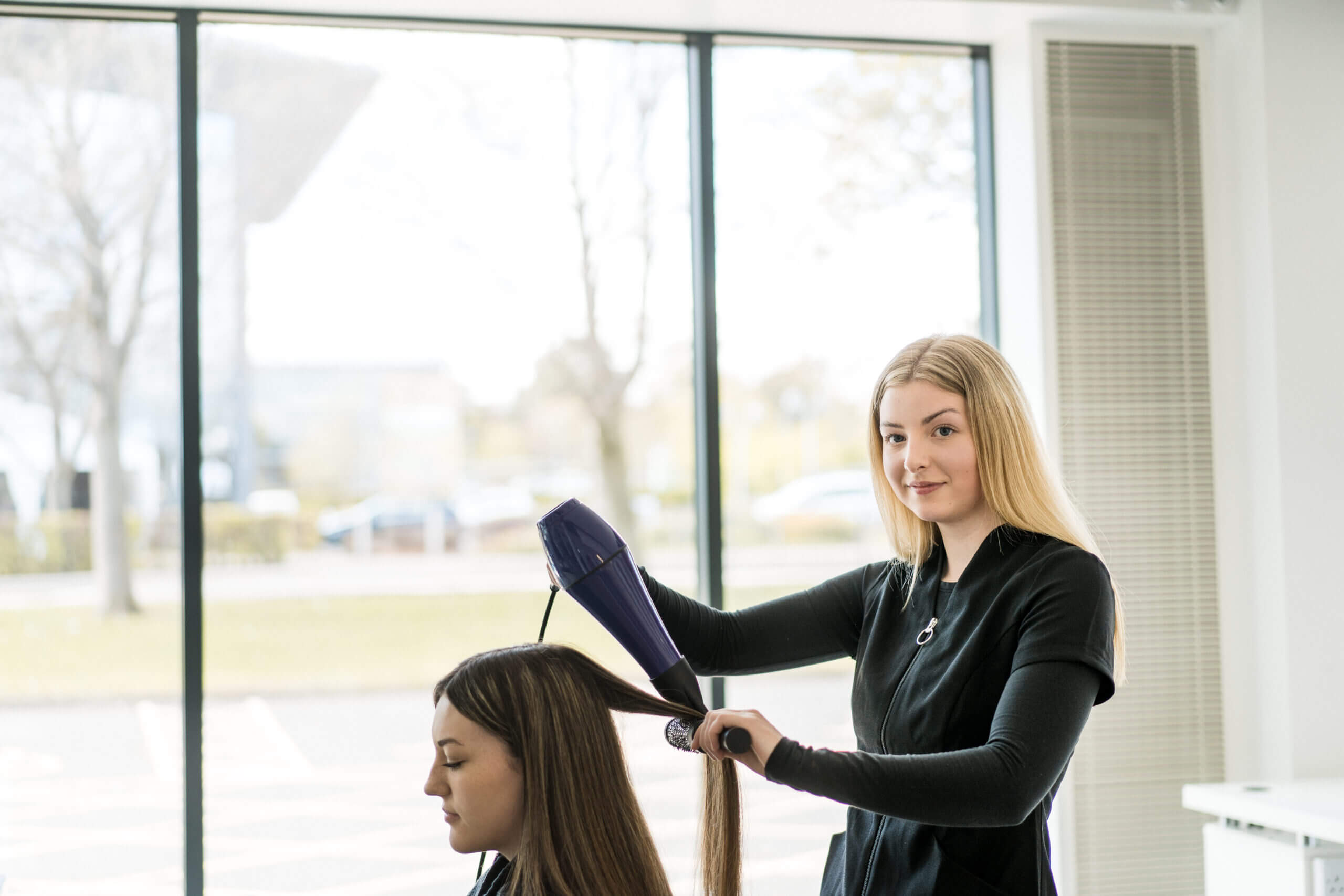 Student working on a clients hair