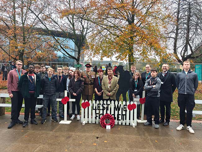 Staff and students gather outside Harrogate College to pay respects for Remembrance Day