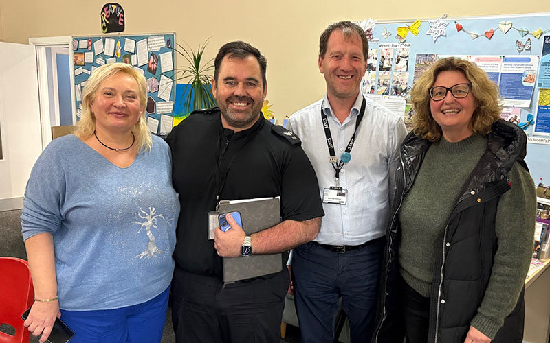 Two Community Interpreting students stood smiling with North Yorkshire police officer and Harrogate College Programme Manager
