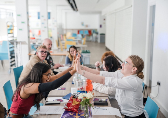 Students giving each other a high five