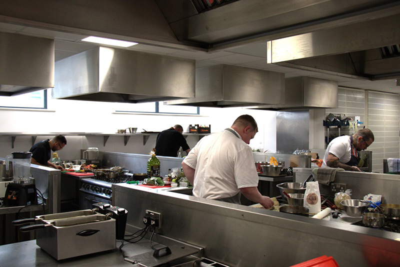 Chefs cooking in the catering kitchens at Harrogate College