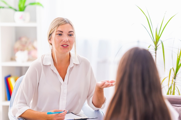 Tutor in conversation with a woman