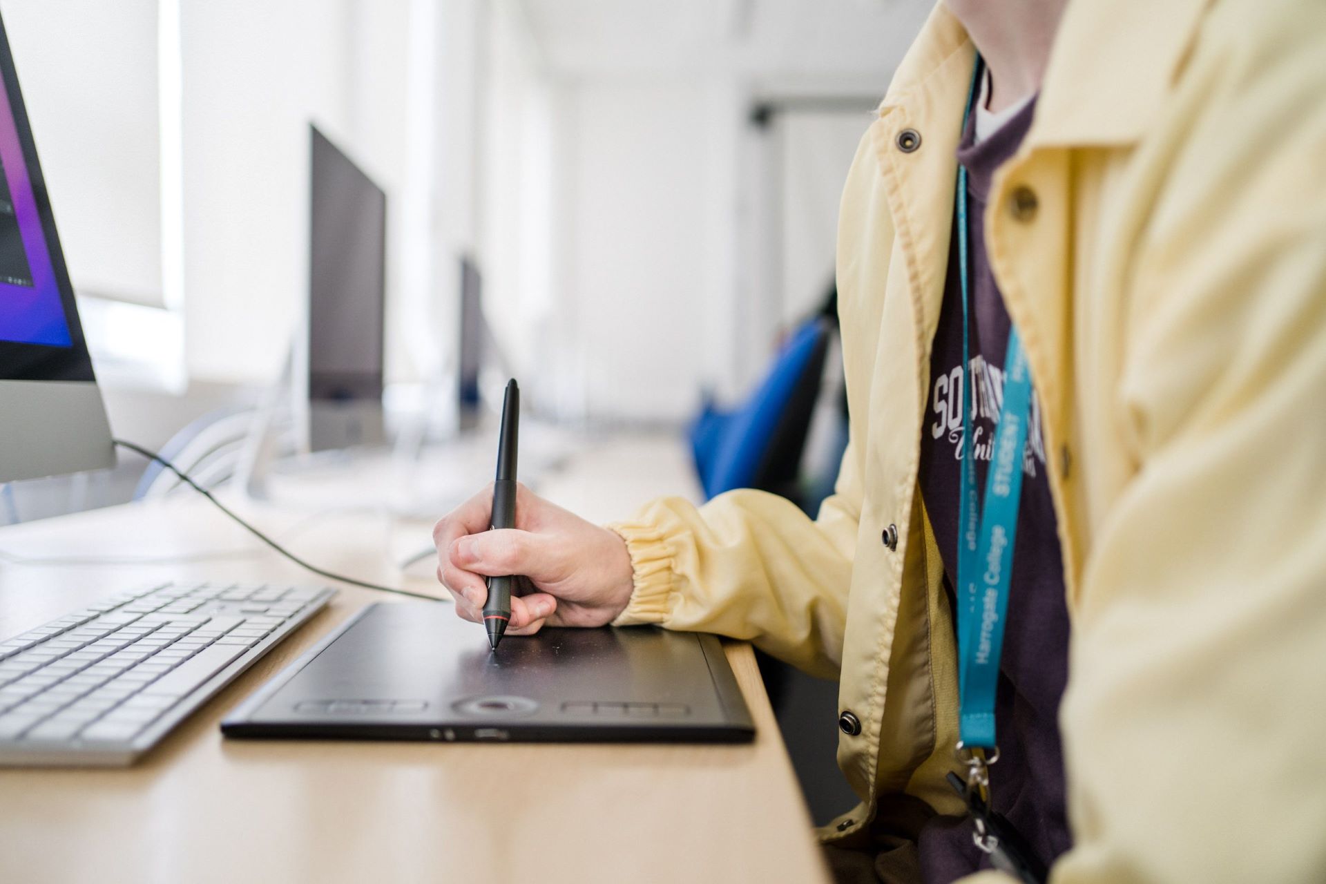 Student using a tablet to create models for a game