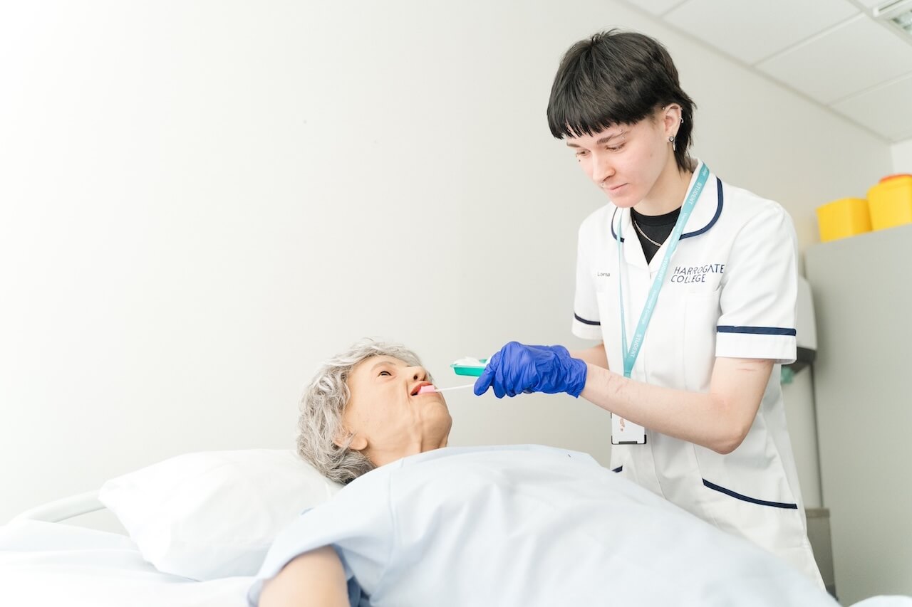 A student working on the health dummy