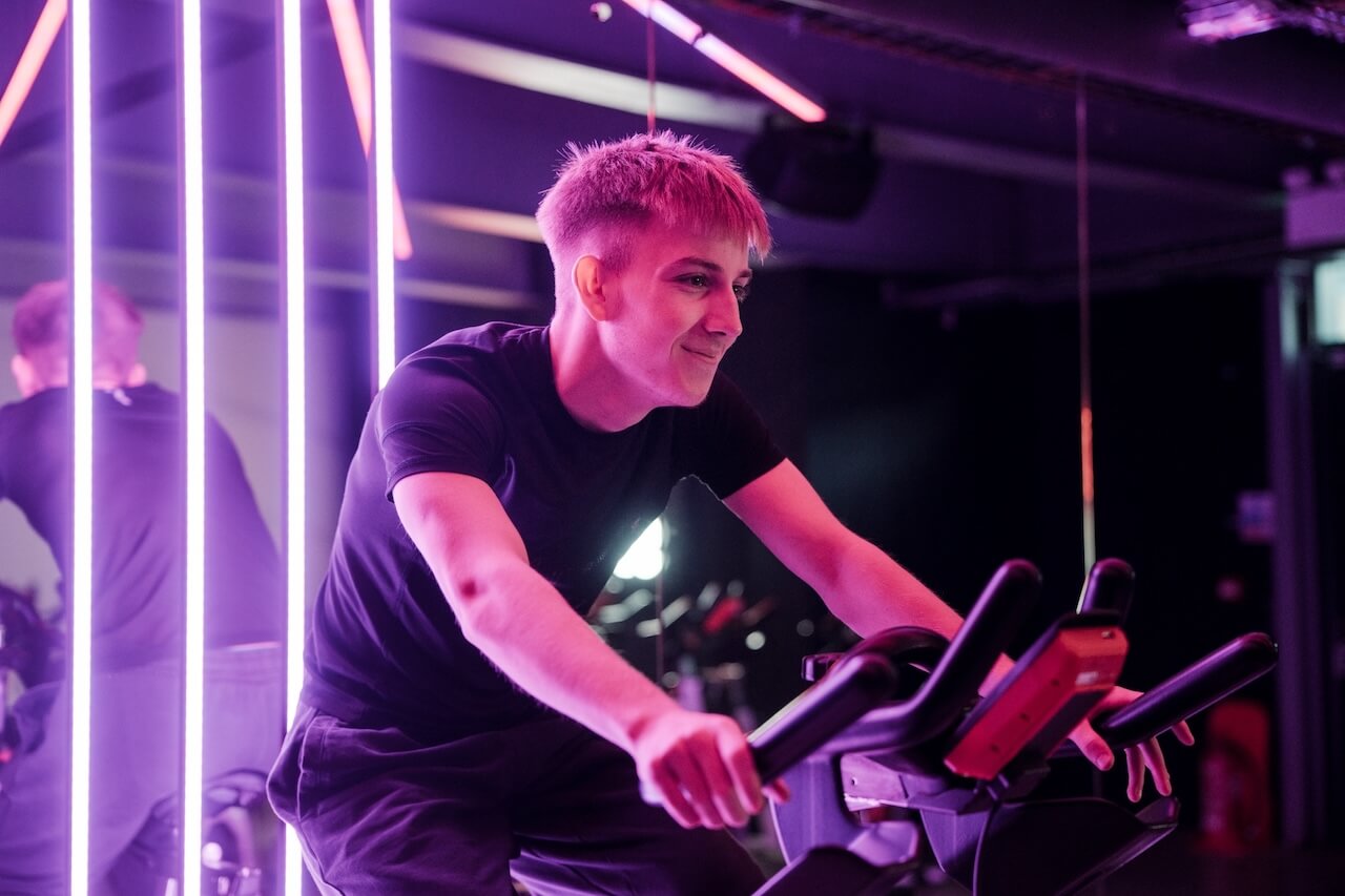 Student riding an exercise bike