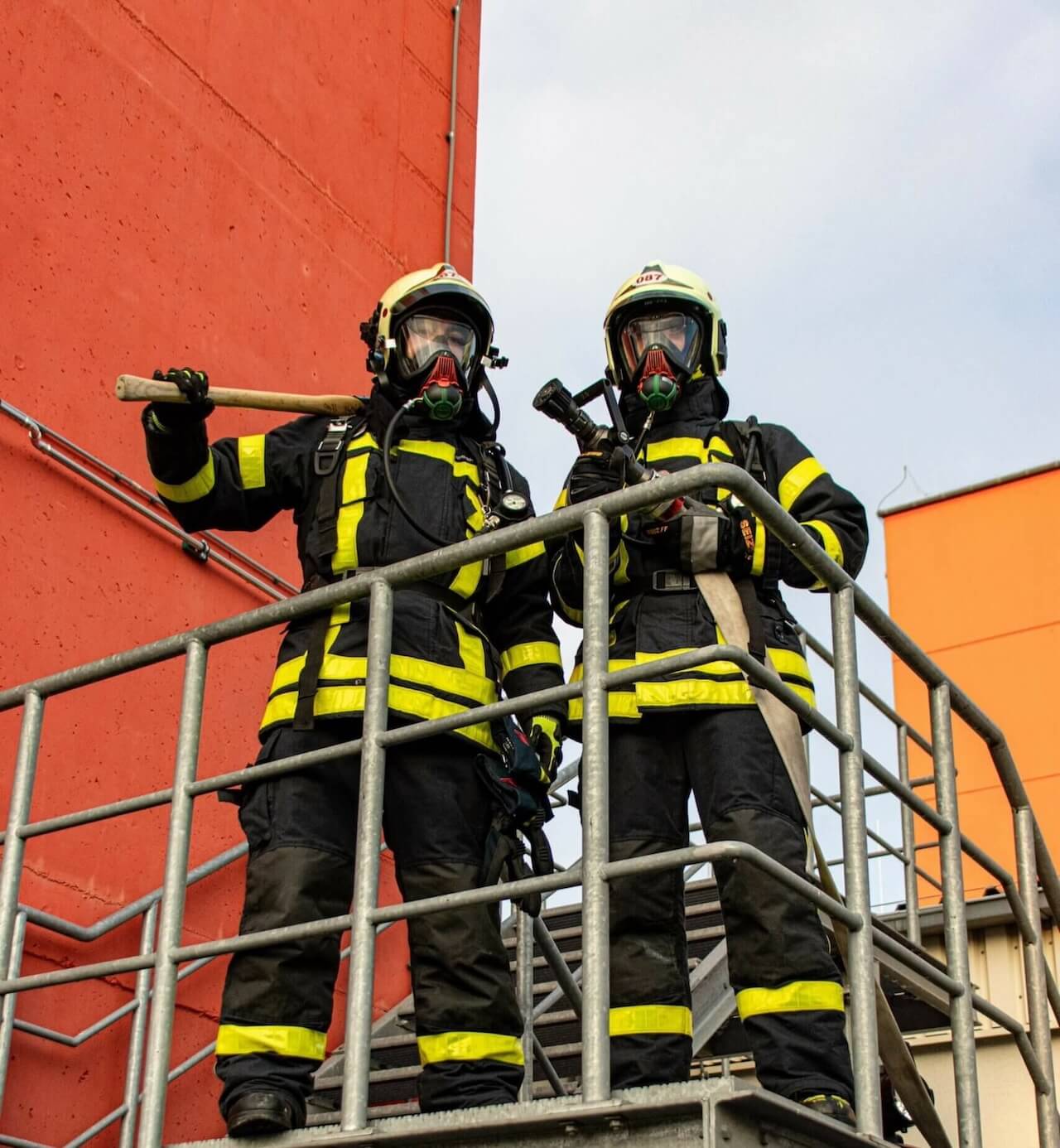 Two students with fire safety equipment
